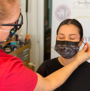 Shauna brushing a clients healed brows